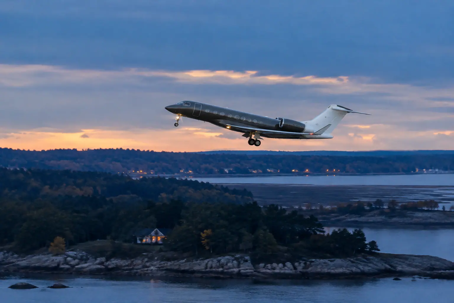 Private jet climbing out over Boston